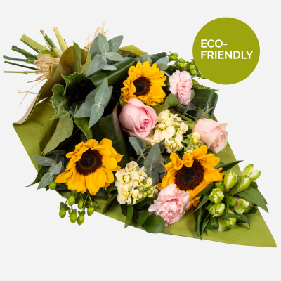 Day Break - Brighten the dullest of days with this glorious array of flowers. Send amazing sunflowers with a complement of selected blooms... Bright and stunning flowers swathed in a wrap friendly and natural. Flowers are hand delivered by the local florist.